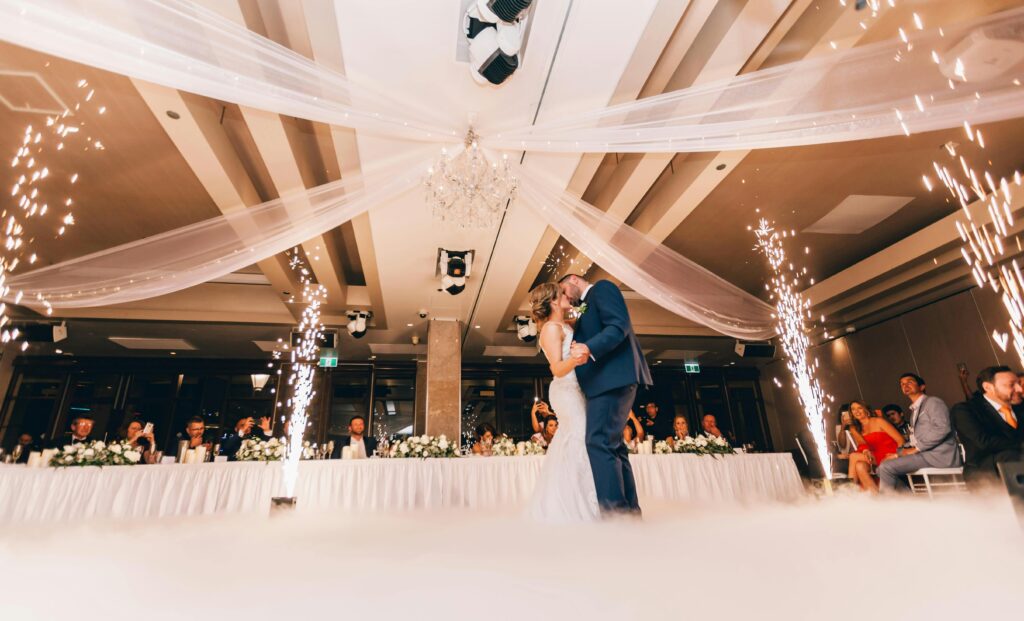 pexels-photo-3082764-3082764 Romantic bride and groom dance surrounded by sparklers at a luxurious Sydney wedding reception.
